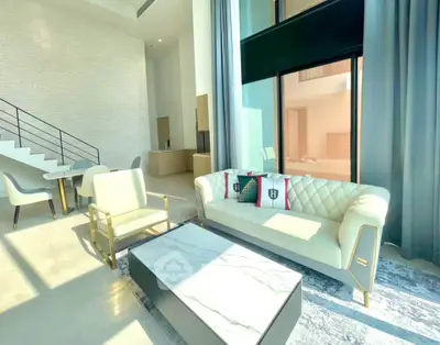 Luxurious modern living room with high ceilings and elegant furniture