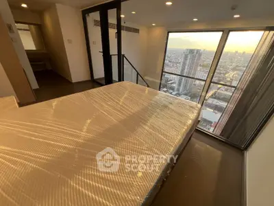 Luxurious bedroom with stunning city view and floor-to-ceiling windows in modern high-rise apartment.