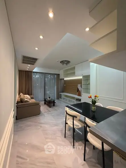 Modern living room with elegant dining area and stylish decor