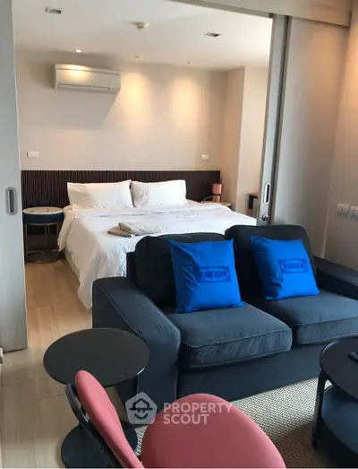 Modern living room with stylish decor and cozy seating area.