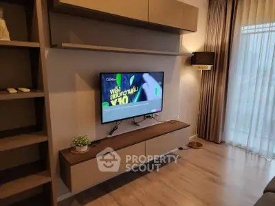 Modern living room with wall-mounted TV and stylish shelving