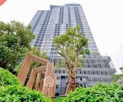 Stunning high-rise building with lush greenery and modern architectural design.