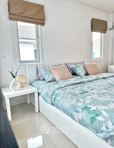 Cozy bedroom with stylish decor and natural light