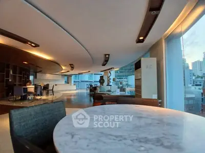Luxurious modern living room with panoramic city views and elegant furnishings
