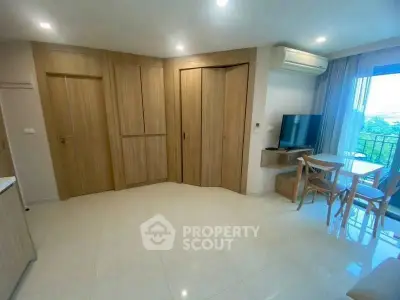 Modern living room with wooden accents and balcony view