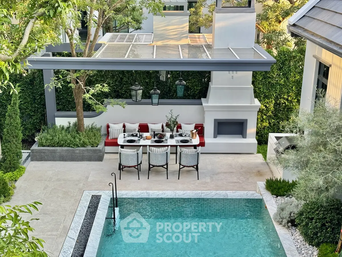 Luxurious outdoor dining area by a pristine pool with modern design and lush greenery.