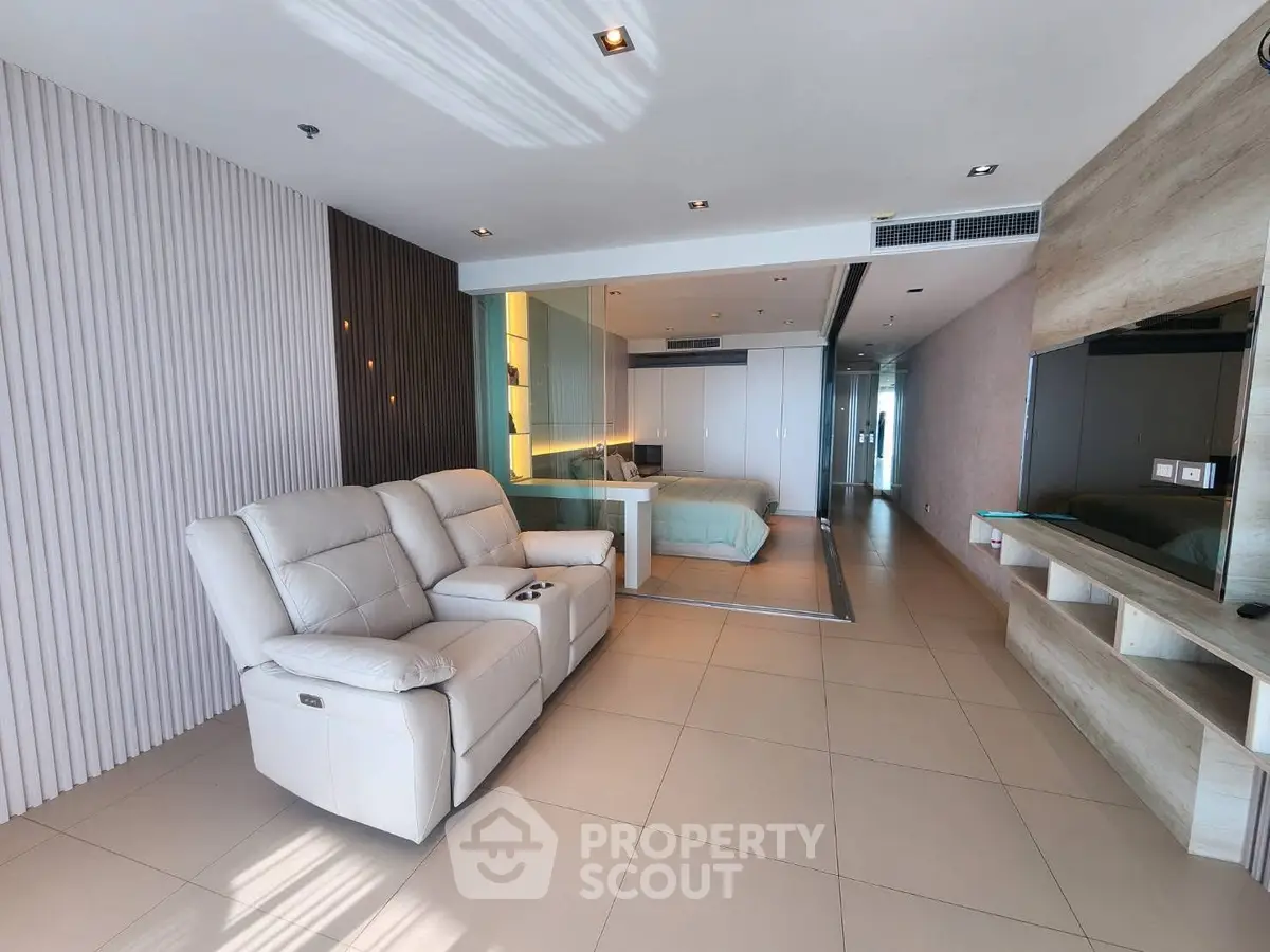 Spacious modern living room with luxurious recliners and stylish decor