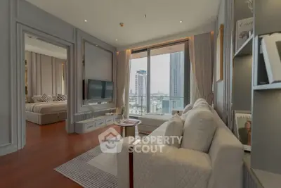 Luxurious living room with modern decor and city view, adjacent to elegant bedroom.