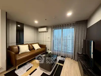 Modern living room with city view, featuring sleek furniture and stylish decor.