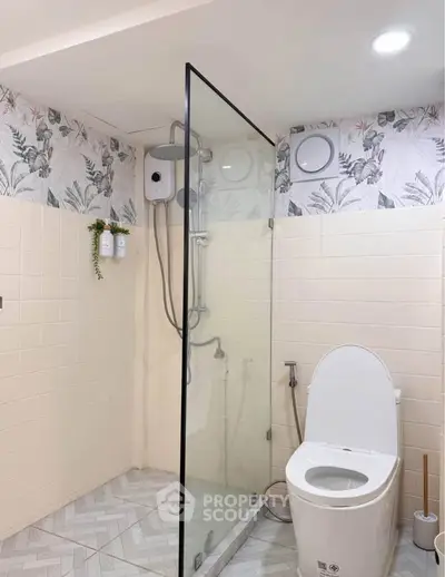 Modern bathroom with glass shower and stylish tile design