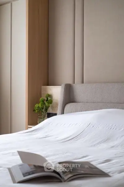 Elegant bedroom with modern design and cozy atmosphere, featuring a stylish bed and soft lighting.