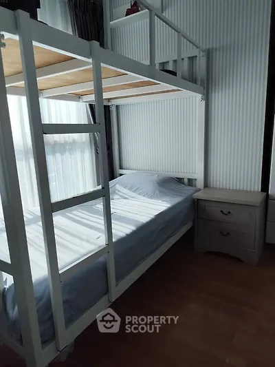 Modern bedroom with stylish bunk bed and natural light