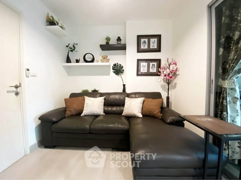 Stylish living room with leather sofa and decorative shelves