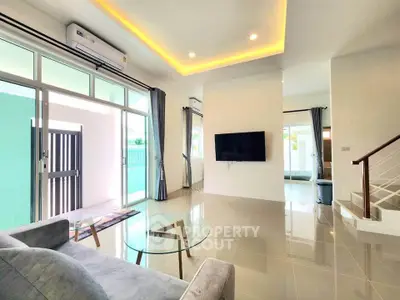 Spacious modern living room with sleek design and natural light