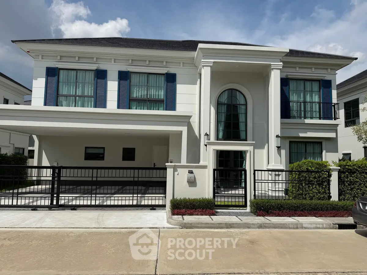 Elegant two-story house with modern facade and spacious driveway