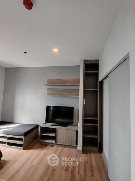 Modern living room with sleek TV stand and built-in shelving