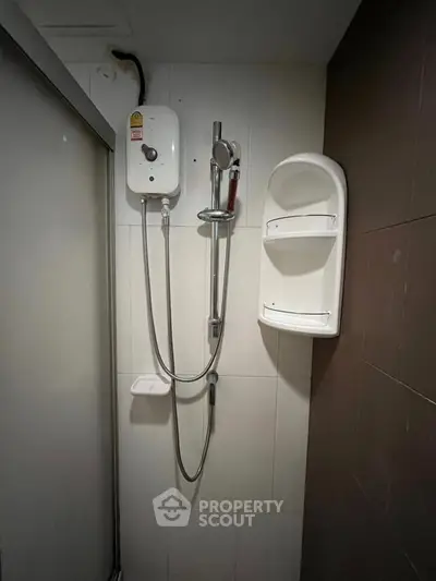 Modern bathroom with shower and water heater, sleek design for comfortable living.