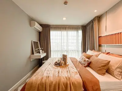 Cozy and stylish bedroom with modern decor and ample natural light.