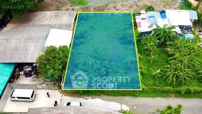 Prime real estate plot with lush greenery, ideal for development in a serene neighborhood.