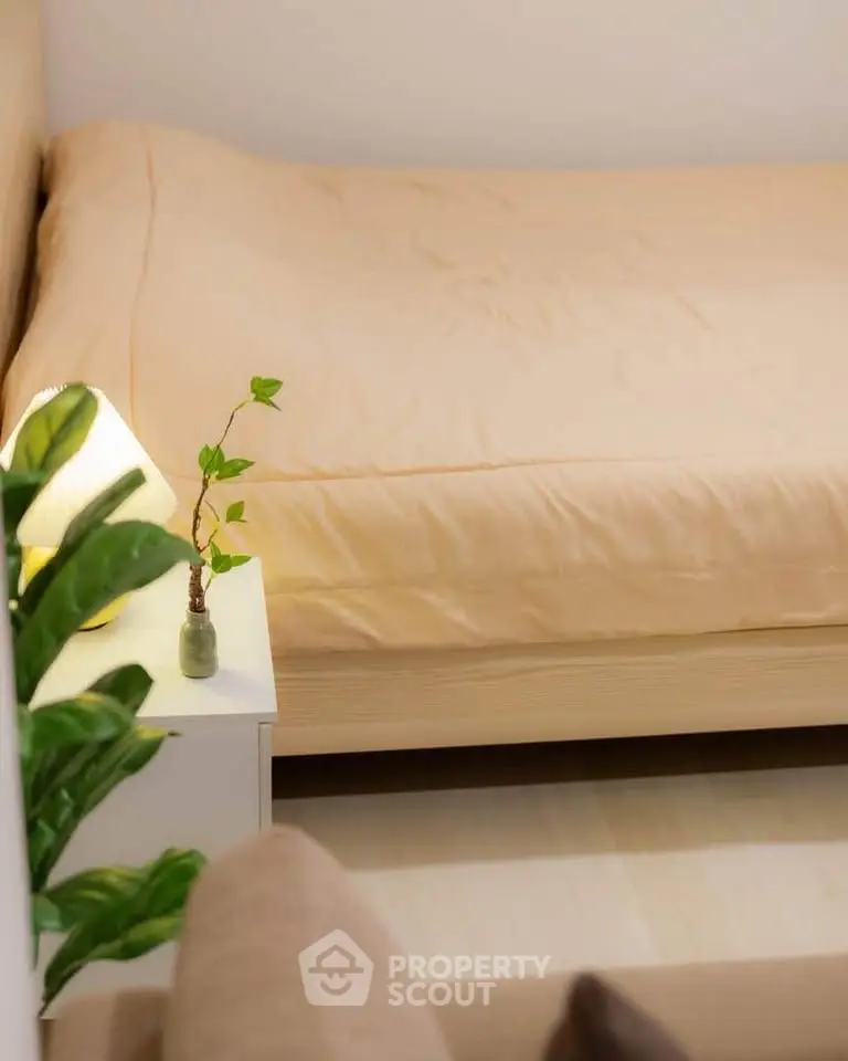 Cozy bedroom with soft lighting and minimalistic decor, perfect for relaxation.