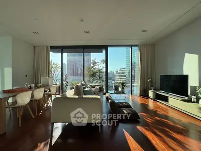 Spacious modern living room with large windows and city view