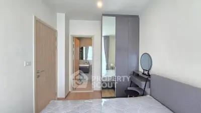 Modern bedroom with ensuite bathroom and stylish furniture