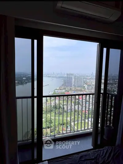 Stunning high-rise apartment with breathtaking river and city views from the balcony.
