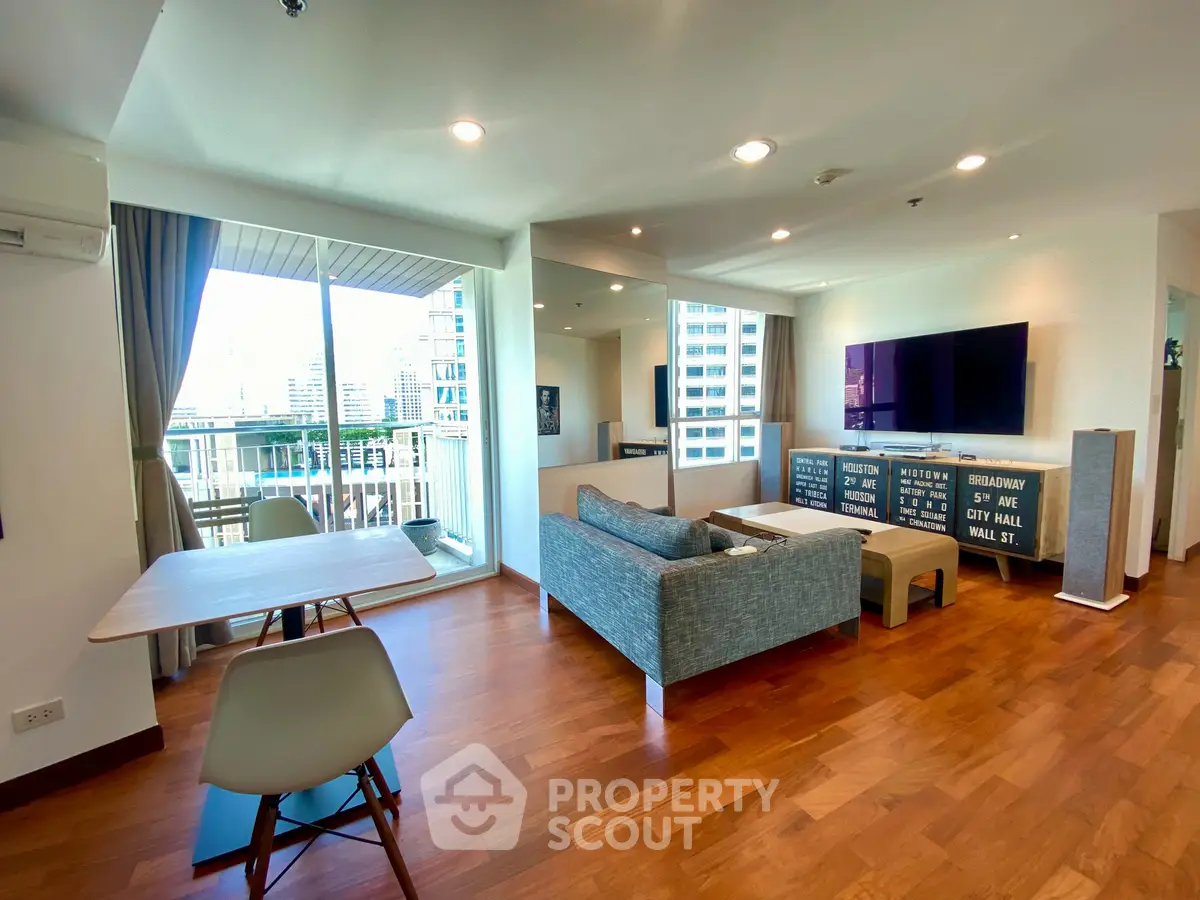 Spacious modern living room with city view and stylish decor