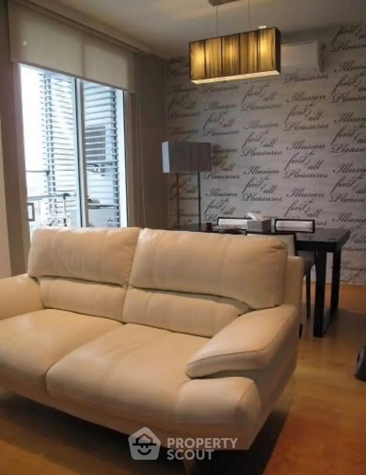 Modern living room with stylish decor and large windows