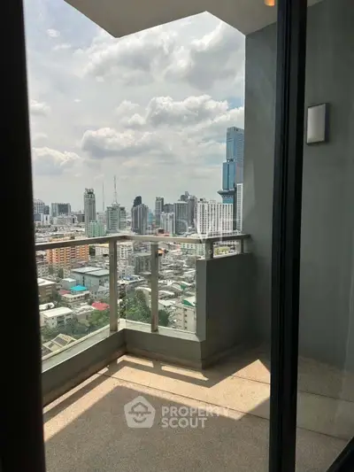 Stunning city view from a modern high-rise balcony, perfect for urban living.