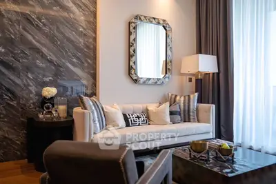 Luxurious living room with elegant decor, plush sofa, and stylish mirror, perfect for modern living.