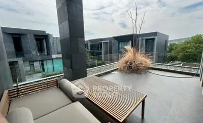 Luxurious modern balcony with sleek design and stunning view of contemporary architecture.