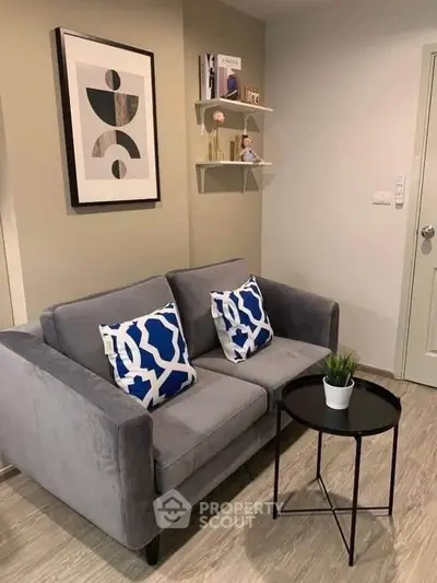 Cozy living room with modern gray sofa and stylish decor