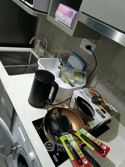 Modern kitchen with sleek appliances and stylish cookware, perfect for culinary enthusiasts.
