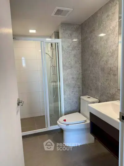 Modern bathroom with sleek design and glass shower enclosure