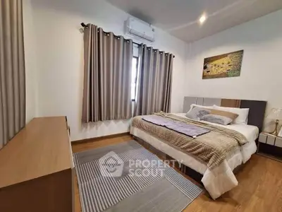 Cozy bedroom with modern decor and natural light