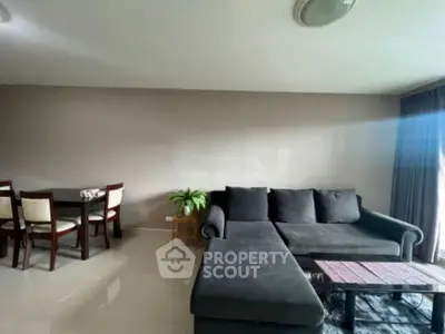 Modern living room with cozy seating and dining area