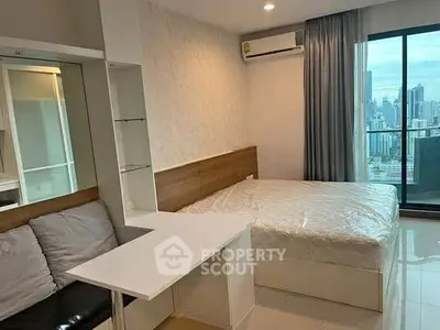 Modern bedroom with city view, featuring sleek design and natural light, perfect for urban living.