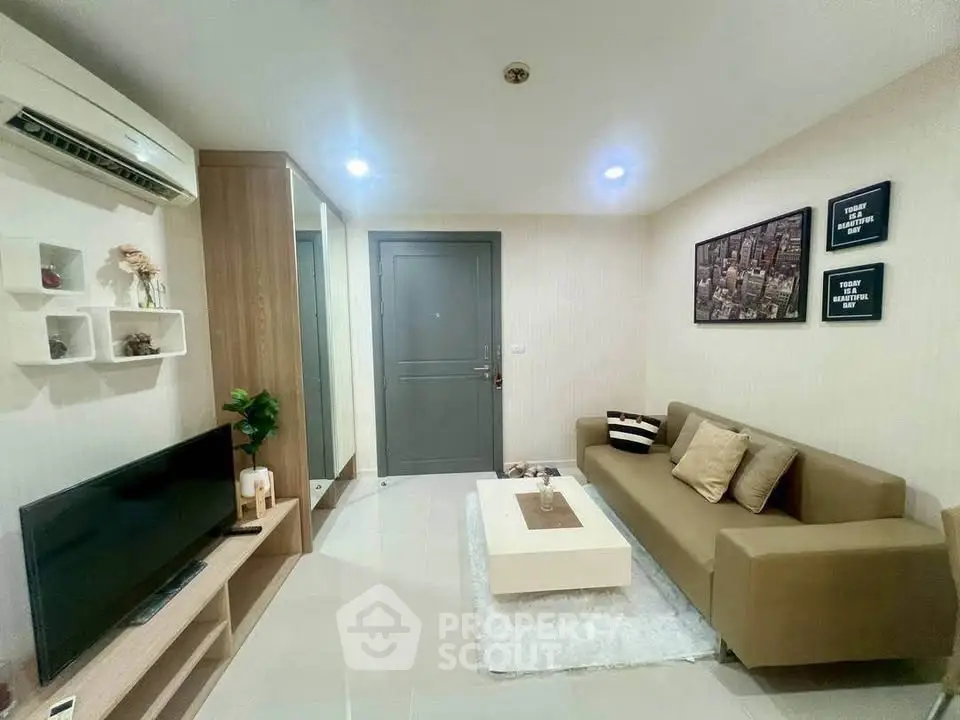 Modern living room with sleek furniture and stylish decor in a cozy apartment.