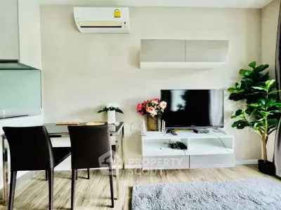 Modern living room with sleek furniture and air conditioning, perfect for comfortable living.