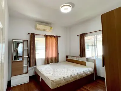 Cozy bedroom with natural light and modern furnishings