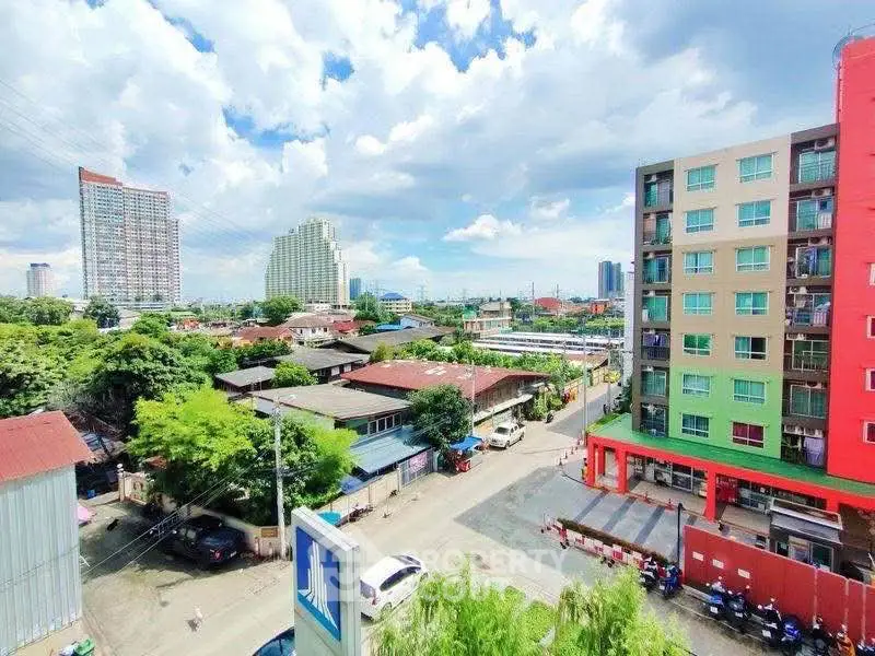 Vibrant urban neighborhood with colorful buildings and lush greenery