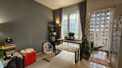 Cozy study area with natural light and modern decor in urban apartment