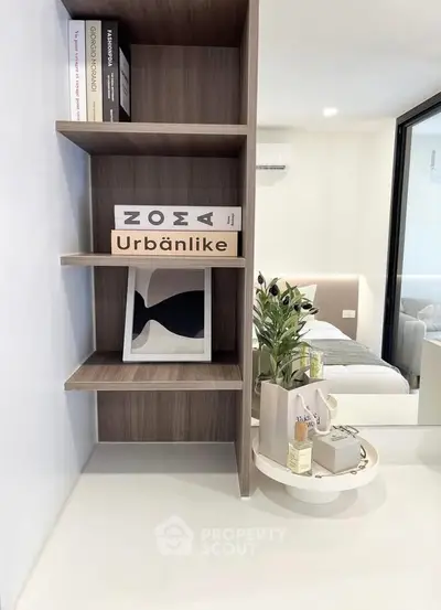 Modern bedroom with stylish shelving and decor accents