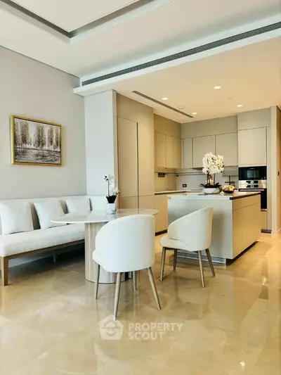 Luxurious modern kitchen with open layout and elegant dining area