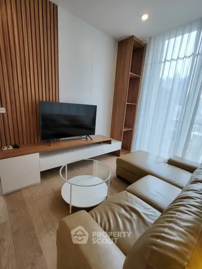 Modern living room with stylish wood paneling and cozy leather sofa