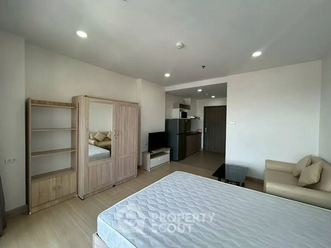 Spacious studio apartment with modern furnishings and open layout