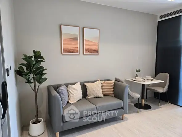 Modern living room with stylish gray sofa and minimalist decor