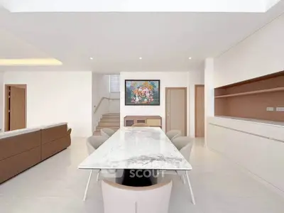Spacious modern living room with elegant marble dining table and stylish decor