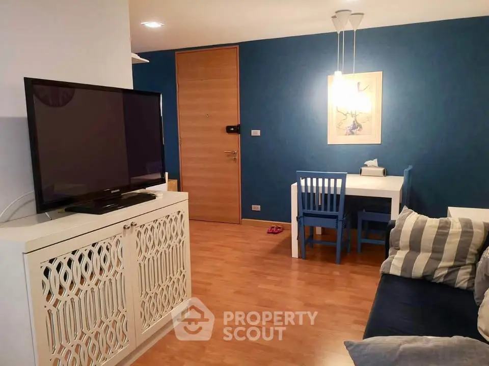 Charming living room with modern decor and cozy seating area, perfect for relaxation and entertainment.